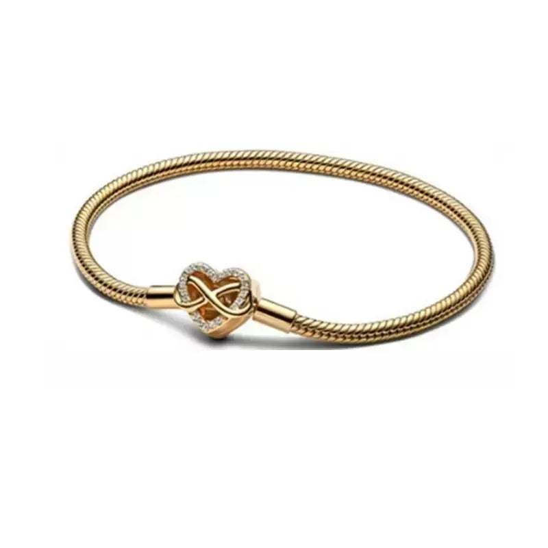 Vergoldetes Schlangen-Gliederarmband mit Unendlichkeitsherz